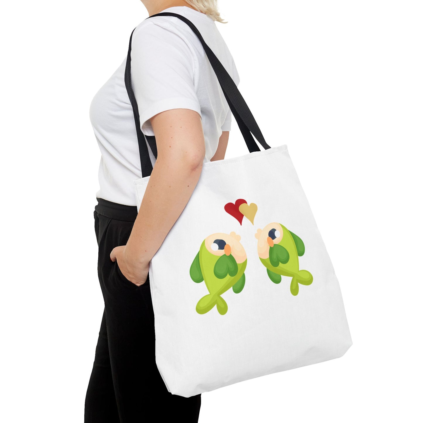 Two hearts float between the fish one red and one yellow. Tote Bag