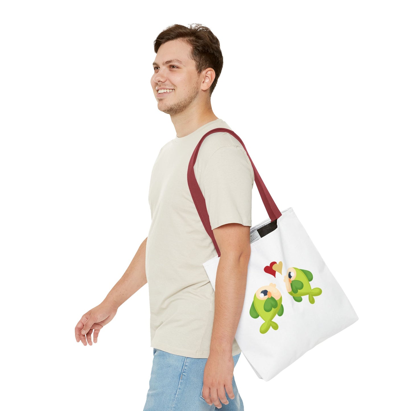 Two hearts float between the fish one red and one yellow. Tote Bag