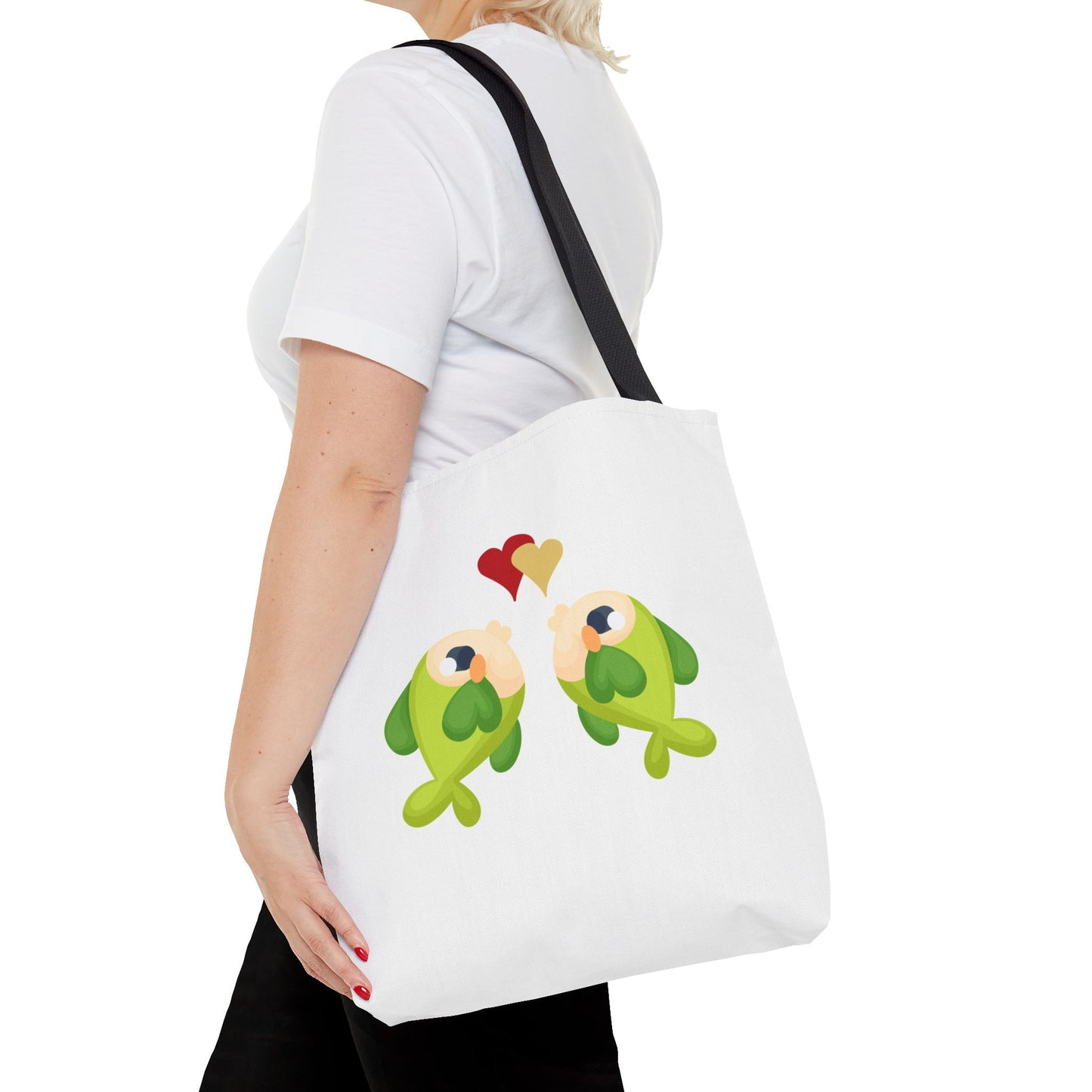 Two hearts float between the fish one red and one yellow. Tote Bag