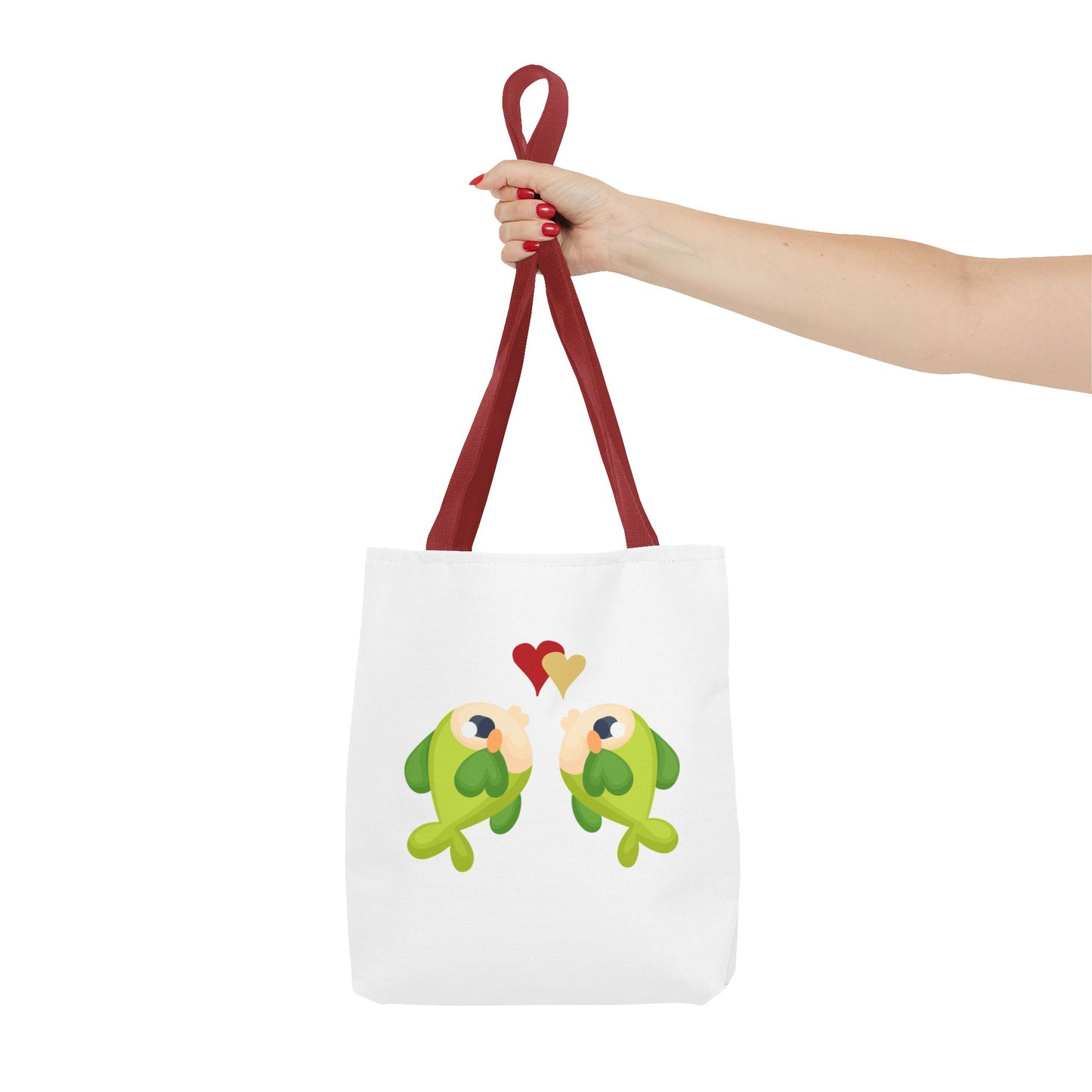 Two hearts float between the fish one red and one yellow. Tote Bag