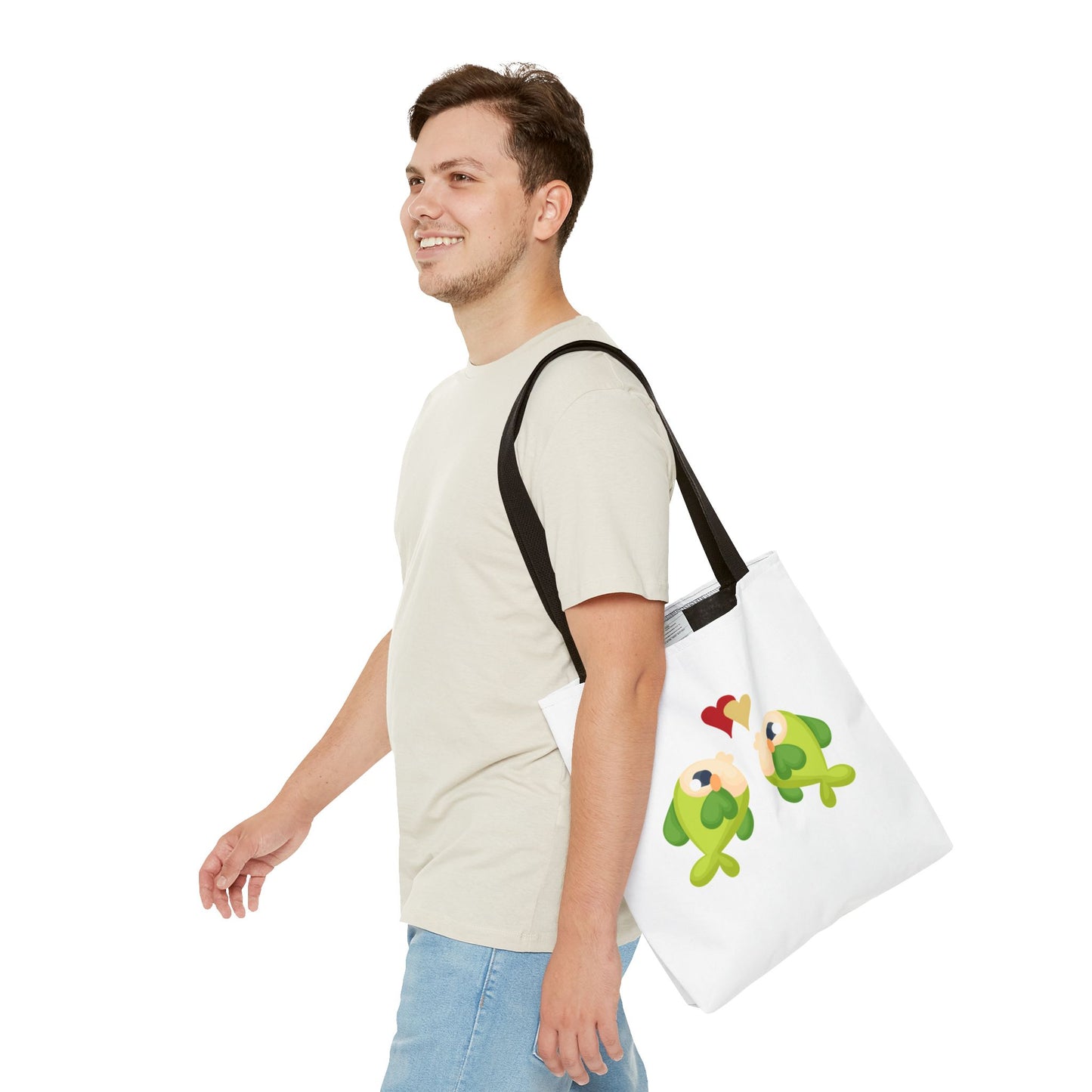 Two hearts float between the fish one red and one yellow. Tote Bag