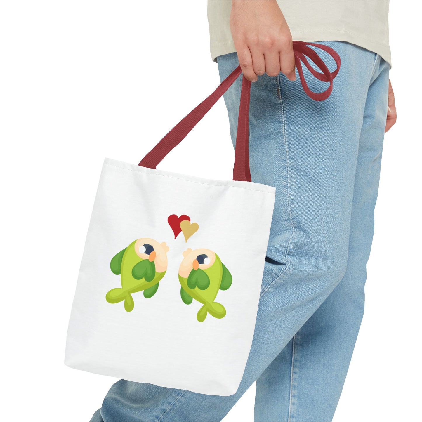 Two hearts float between the fish one red and one yellow. Tote Bag