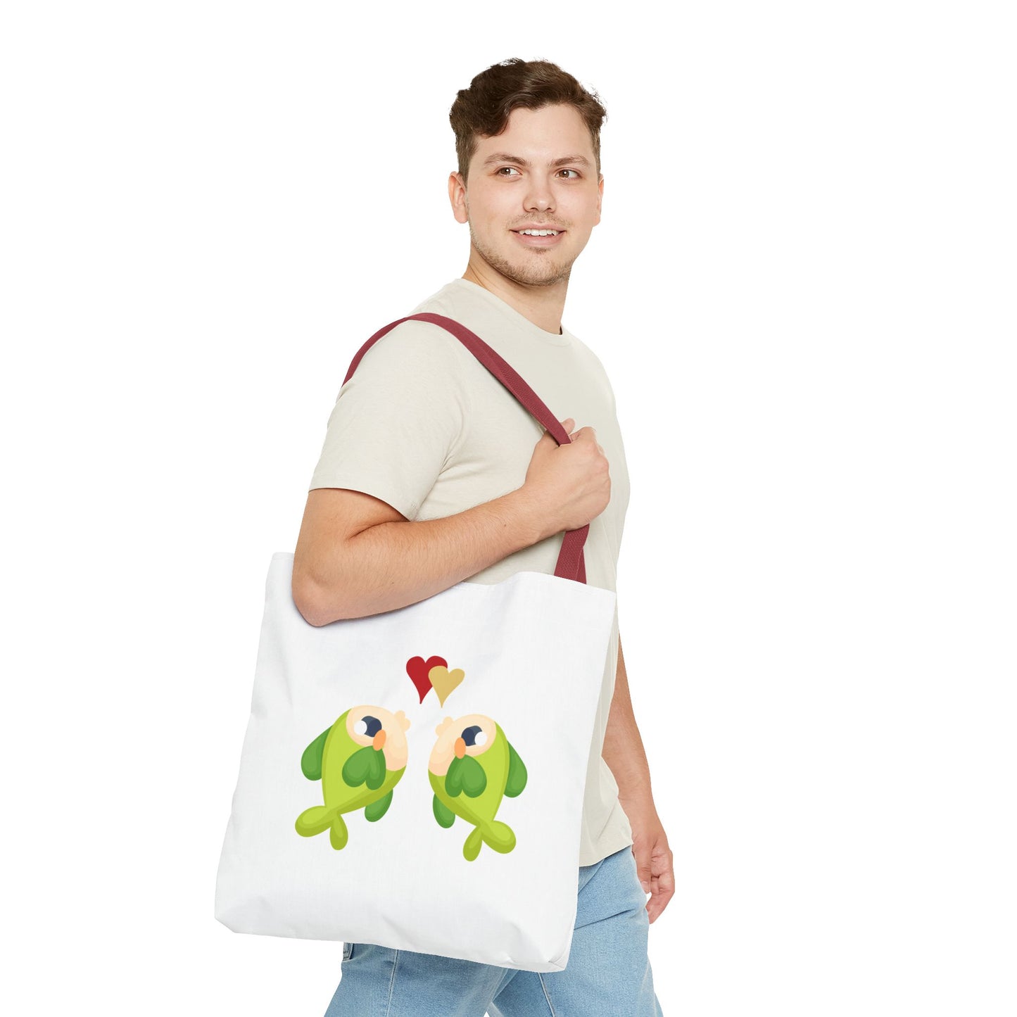 Two hearts float between the fish one red and one yellow. Tote Bag