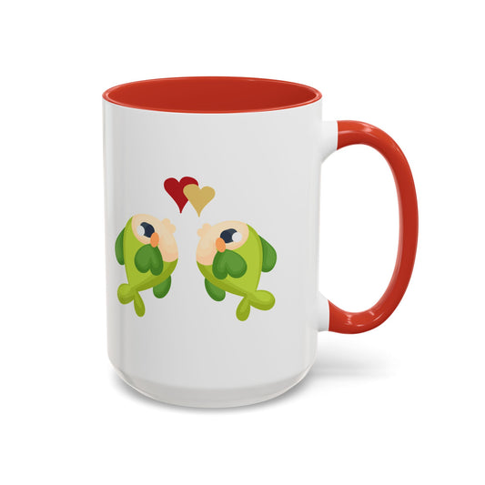 Two hearts float between the fish one red and one yellow. Coffee Mug